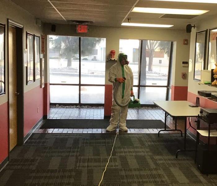 SERVPRO technician getting ready to start misting DISH NETWORK office