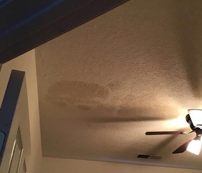 Water leaking through the roof after rain storm.